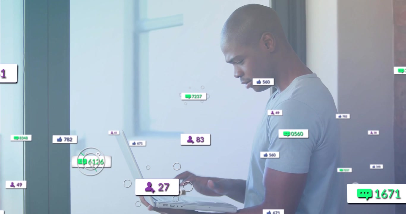 Man starting typing on laptop in technology living area while tracking rising social media counters