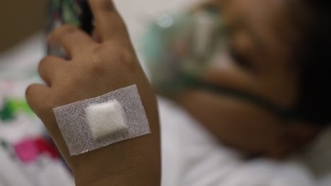 children patients on bed with oxygen mask in hospital