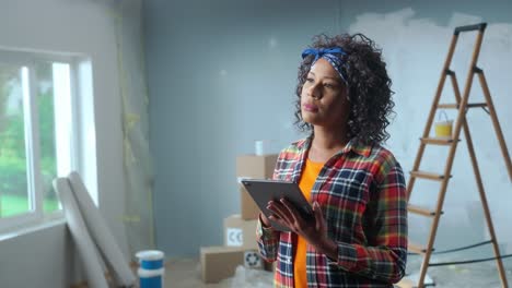 woman using tablet for home renovation planning