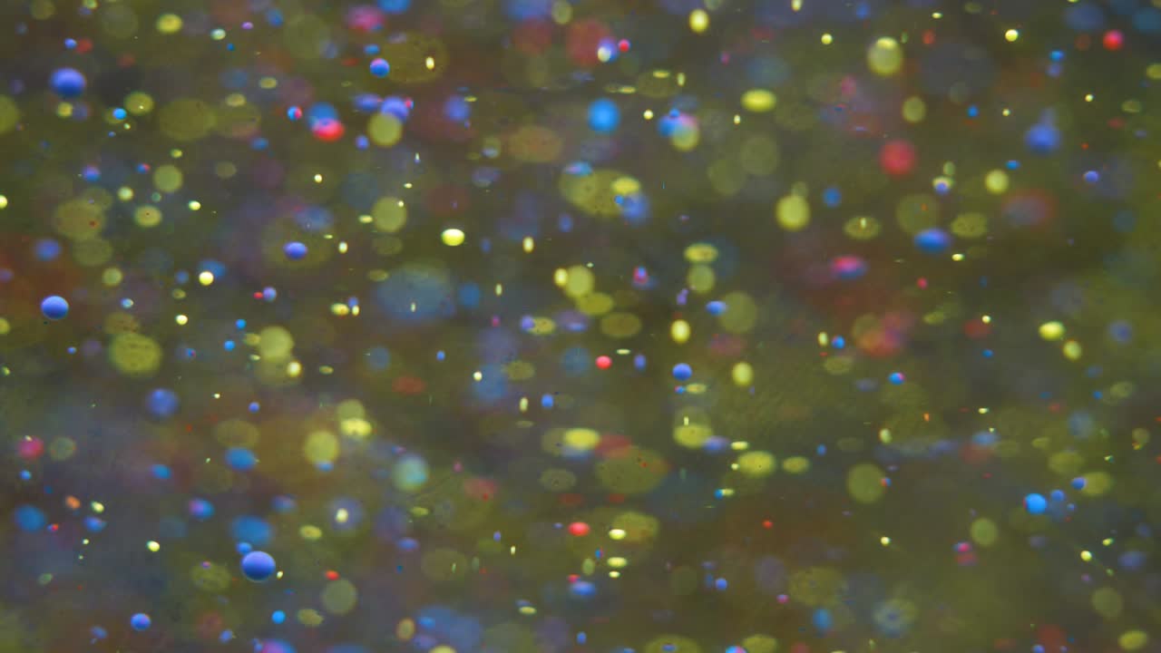 Slow Motion Bright Colors Bubbles Oil Beautiful Paint Universe Color Moving Multicolored Closeup. Acrylic Paint. Fantastic Surface. Abstract Colorful Paint Metamorphosis Structure Colorful Bubbles