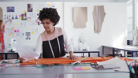 Mixed-race-woman-working-in-fashion-office