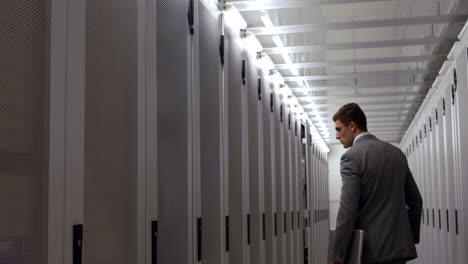 data technician walking through locker hall