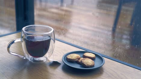 tea and cookies in the warm room on a rainy day