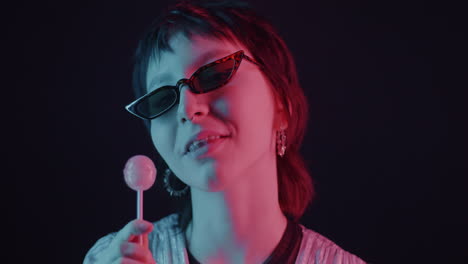neon portrait of a woman with lollipop