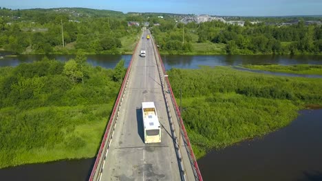 bridge over river with vehicles