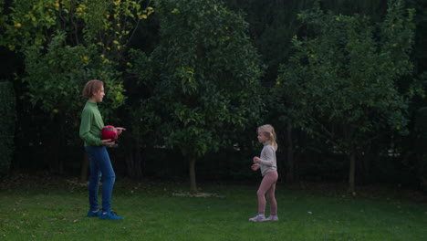 playing edible or inedible game with siblings in the backyard