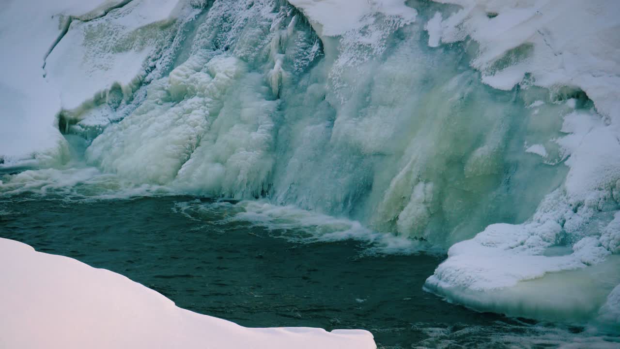 A glacier melting its ice and forming a stream of cold water. Saguenay,  Chicoutimi, Quebec, Canada. Static.