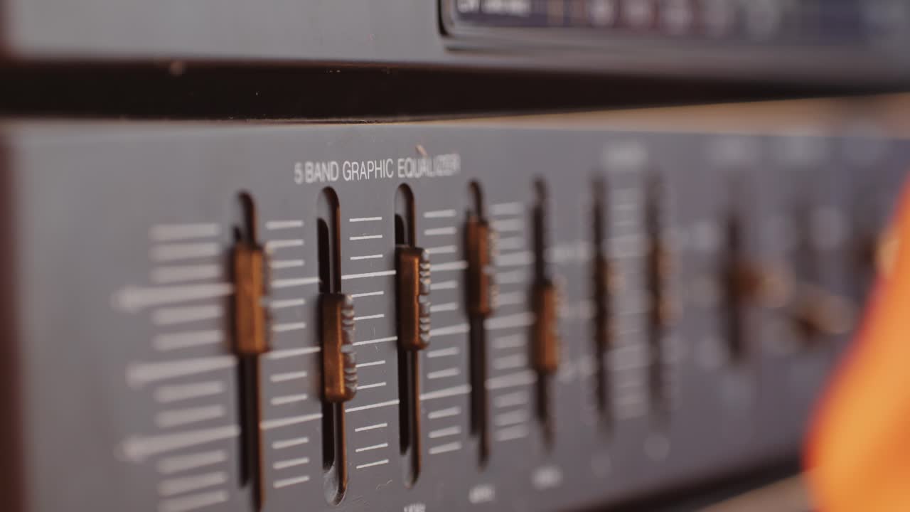 Retro fm am radio tape, music, technology, people and equipment concept - man using mixing console in sound recording studio