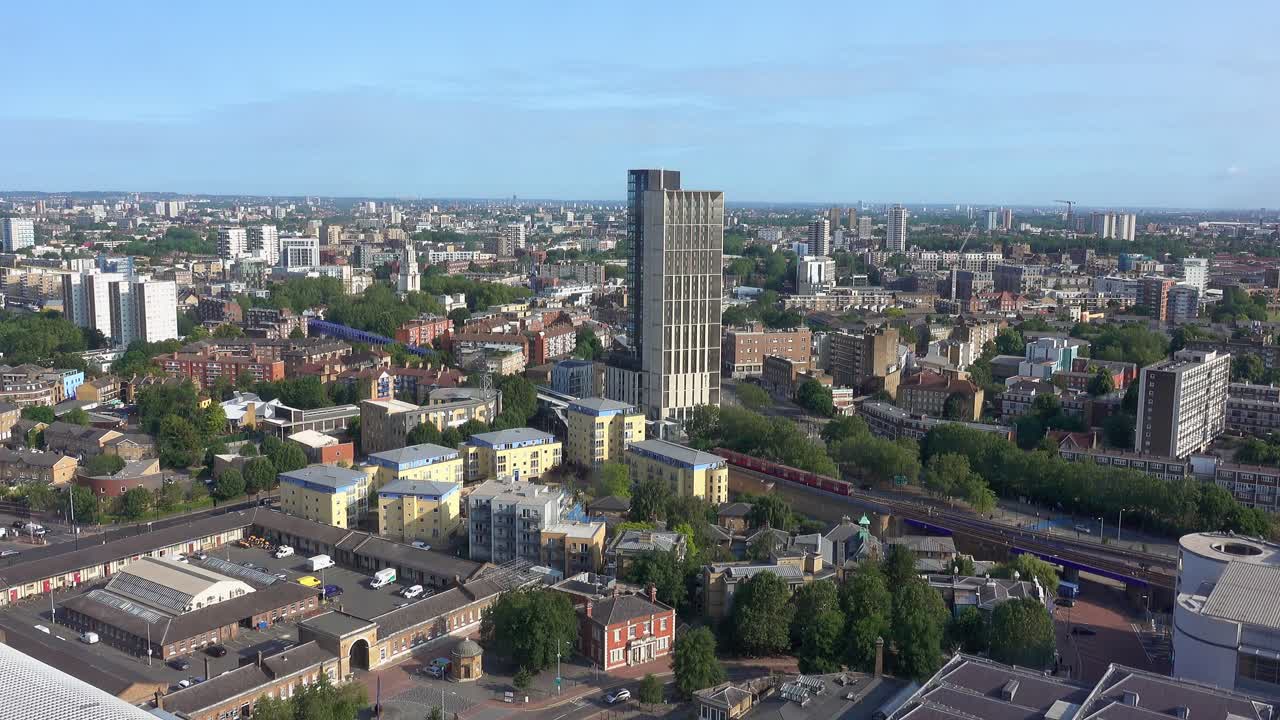London office overlooking the busy skyline as two DLR trains pass each other