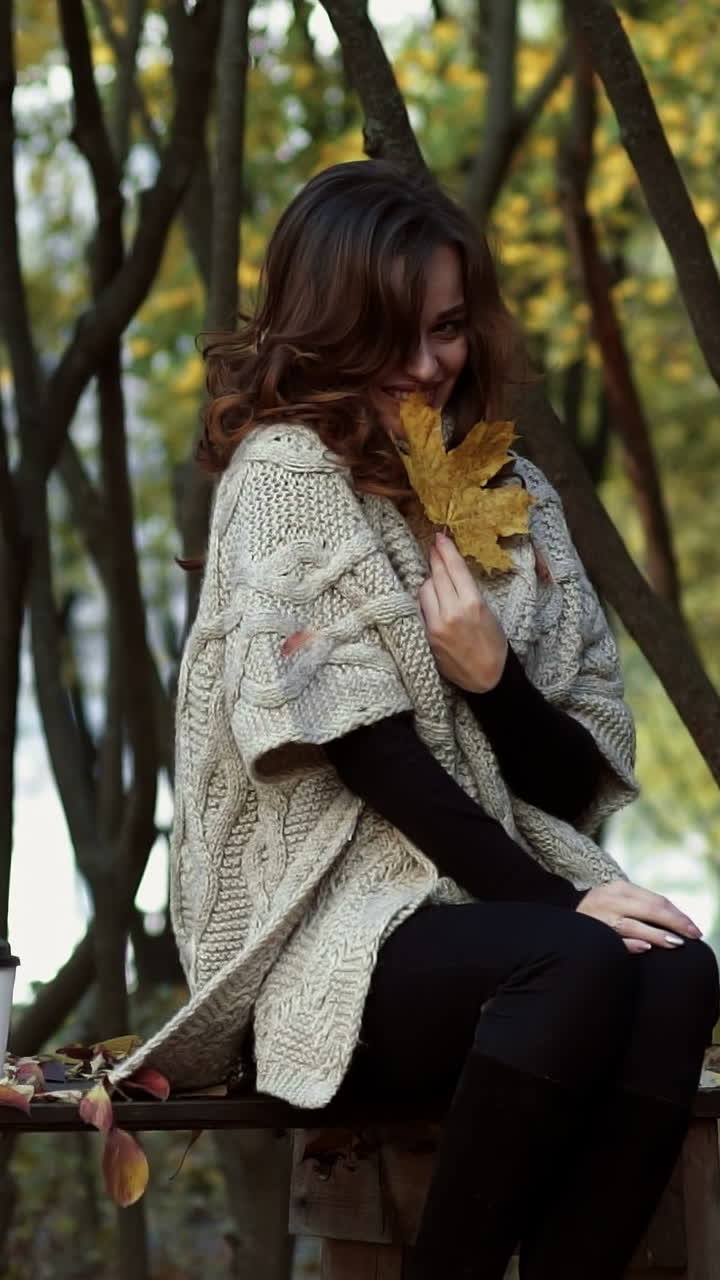 Elegant woman walking in a park. Beautiful elegant woman walking in a park in autumn , Fall concept