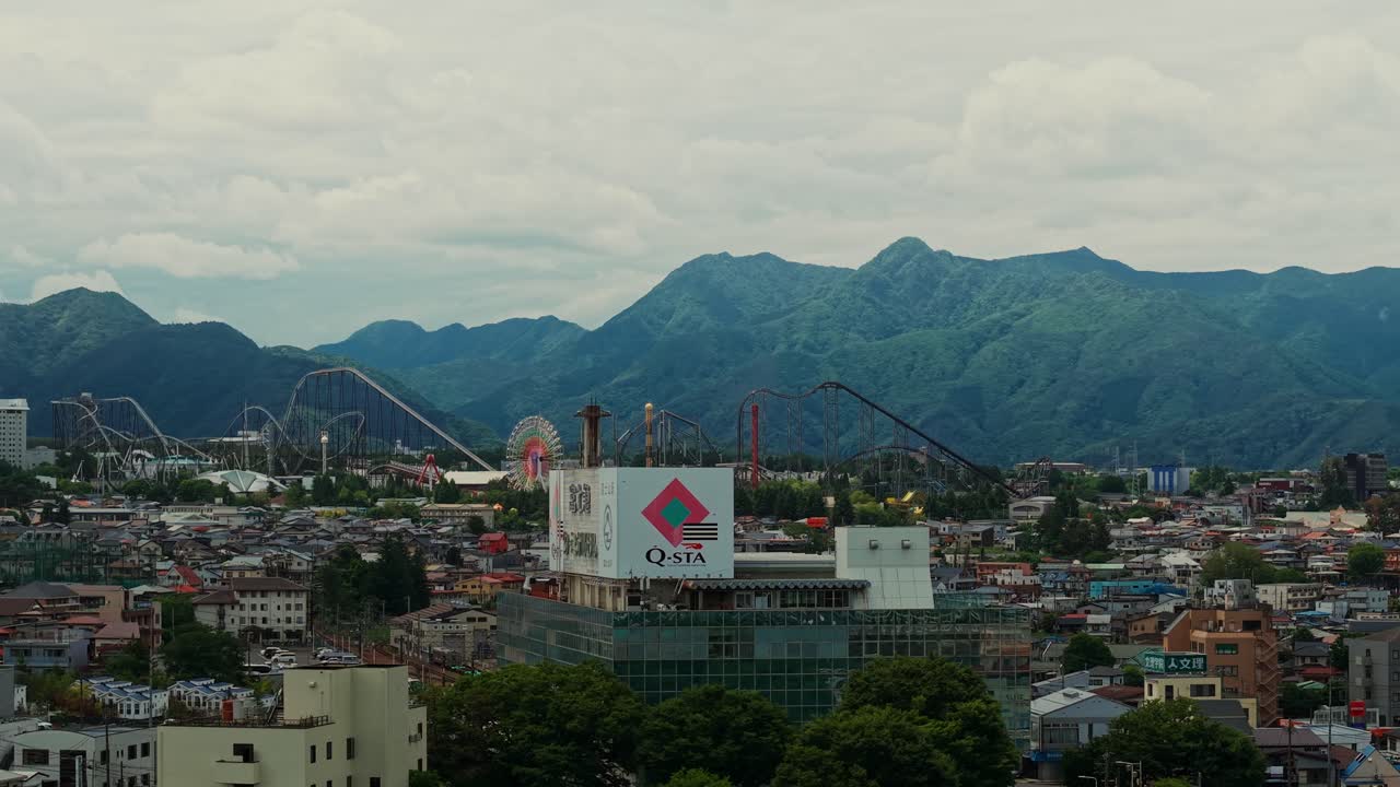 Cityscape with Mountains and Amusement Park
