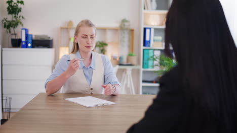 Two-Business-Women-Sign-Contract-and-Shake-Hands