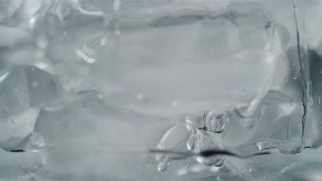 bubbles floating in freezing ice water close-up