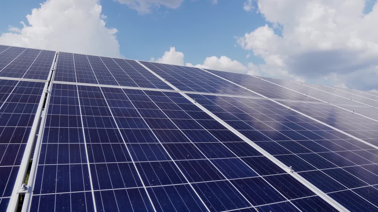 Constructions for the installation of solar panels on the ground. Cells of photovoltaic panels. Solar power plant in the field