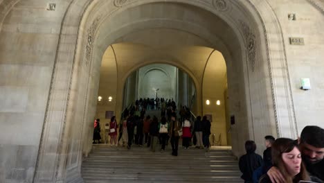 crowds entering louvre museum in paris, france