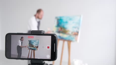an experienced artist conducts online training in painting