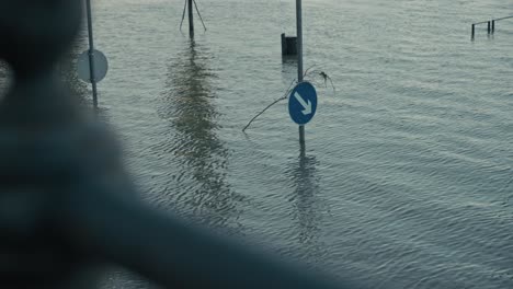 submerged traffic signs partially visible in floodwaters during the budapest flood 2024