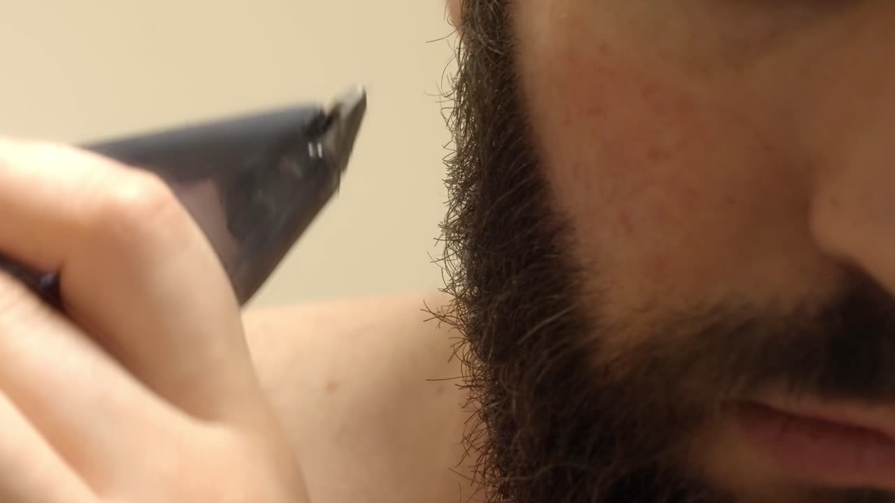 Man’s Facial Hair Trimming with an Electric Groomer