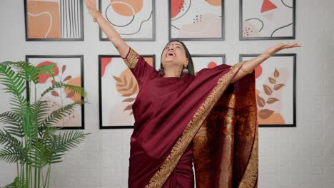 excited indian woman throwing money in air