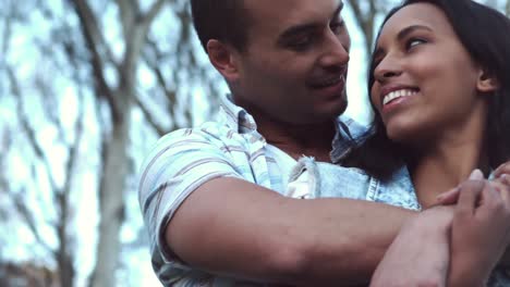 happy young couple embracing together