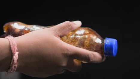 shaking-drink-bottle-closeup-100fps