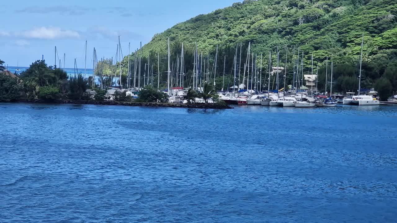 Boat Harbor on Moorea Island, French Polynesia. Sailboats and Green Landscape, View From Ferry Boat
