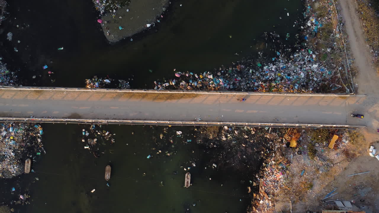 Road crossing a polluted river