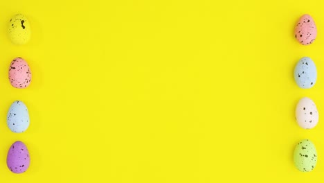 los huevos de pascua de diferentes colores aparecen en el lado izquierdo y derecho del tema amarillo. detenga el movimiento