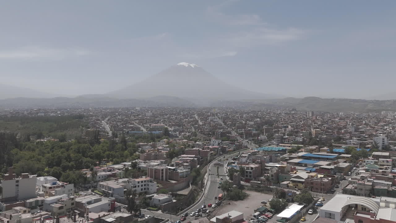 Drone shot above Arequipa Peru on a bright day with some mist with view on the mountain LOG