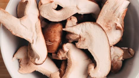 sliced shiitake mushrooms in a white bowl
