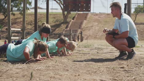 group of caucasian children training at boot camp