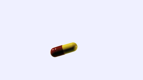 Red-and-yellow-capsule-tablet-falling-and-bouncing