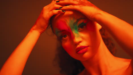 beauty, paint and face of woman in neon lights