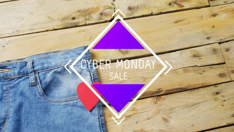 animation of cyber monda sale text over denim trousers on wooden background