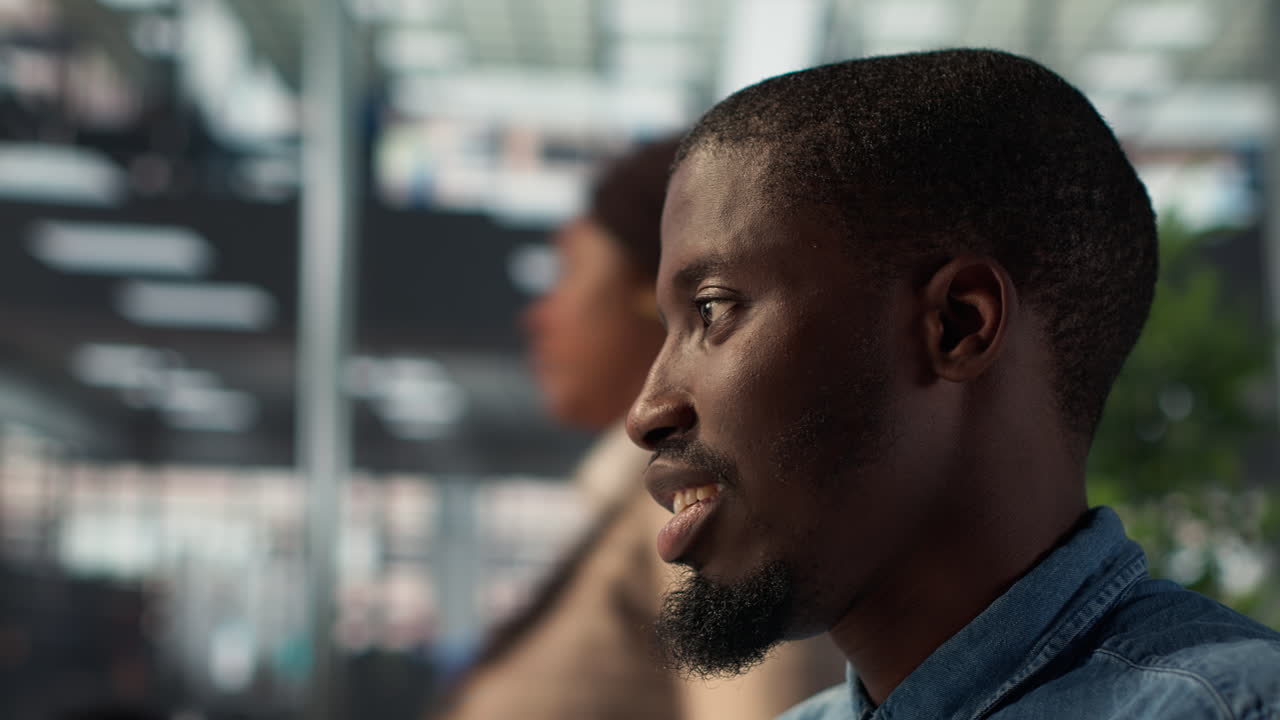 Man in profile view in an office setting