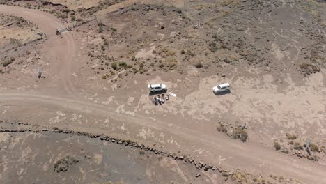 aerial-rotating-shot-of-a-water-point-in-a-mountain-bike-race