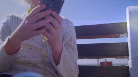 animation of social media icons with numbers over caucasian woman using smartphone