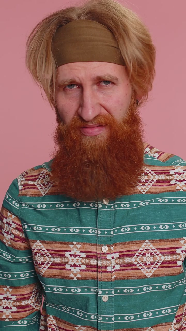 Offended hippie man having misunderstanding frustrated after quarrel ignores does not want talk