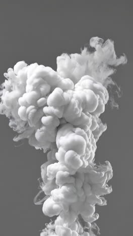 dynamic white smoke plumes against a solid grey background