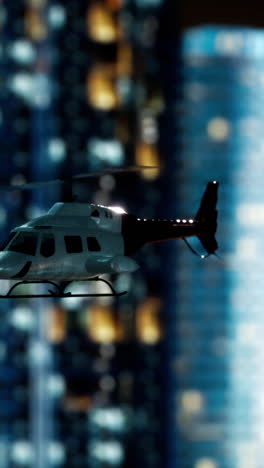 helicopter flying over a city at night