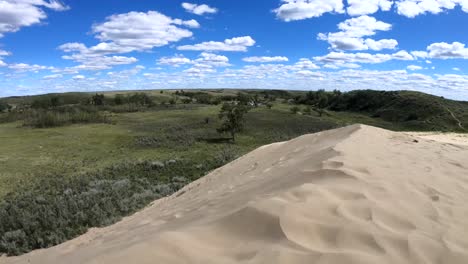 sand blowing in the wind at the alberta sand dunes on a sunny day