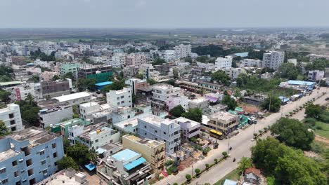 drone view of a highway stretching through a rural area with buildings.