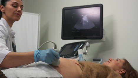 pregnant woman laying on stretcher