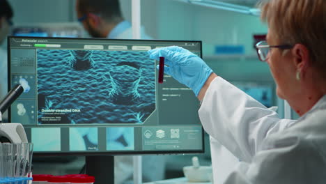 laboratory scientist working with blood test late at night