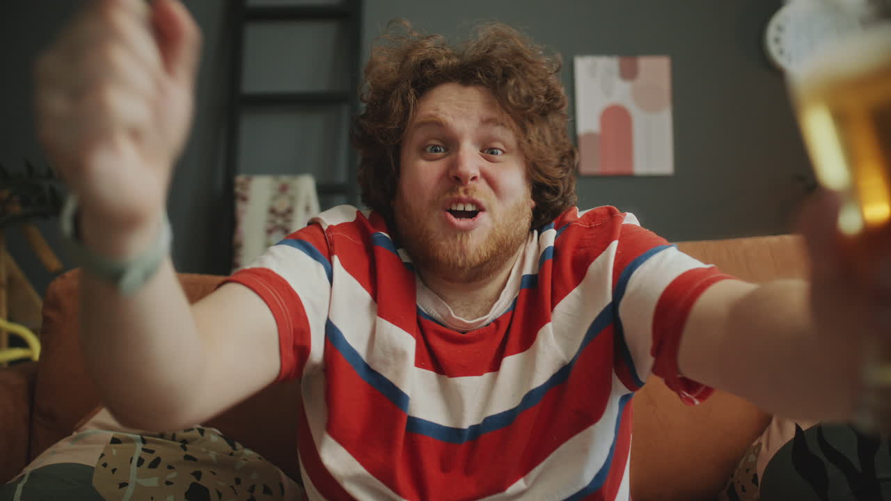 Man Celebrating a Victory with Beer