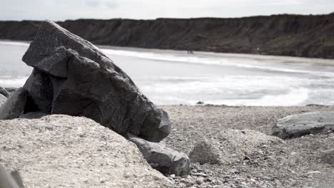 medium wide shot of rocky beach and its hills in england near hornsea