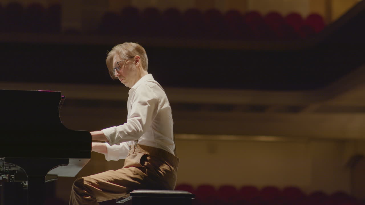 Piano Player Giving Performance on Stage