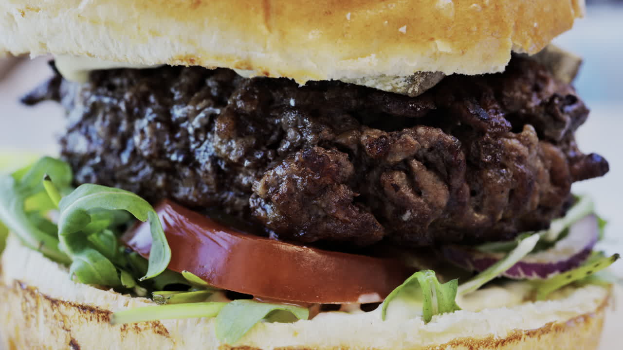 Close up of a hamburger on a plate at a restaurant