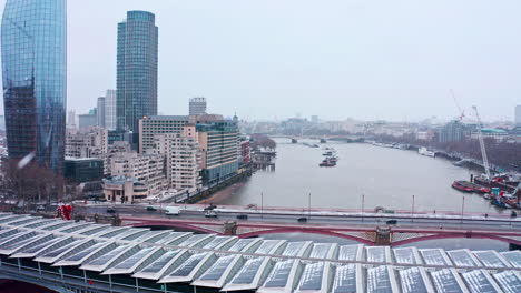 Stationary-aerial-shot-of-Blackfriars-bridge-in-the-snow