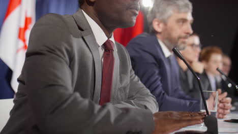black politician speaking in mic at press conference